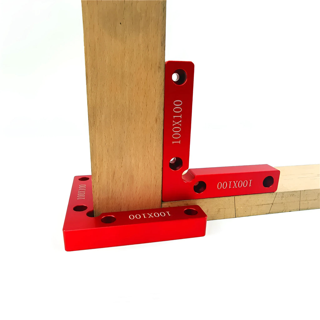 Aluminum alloy woodworking right angle positioning block on a workbench.