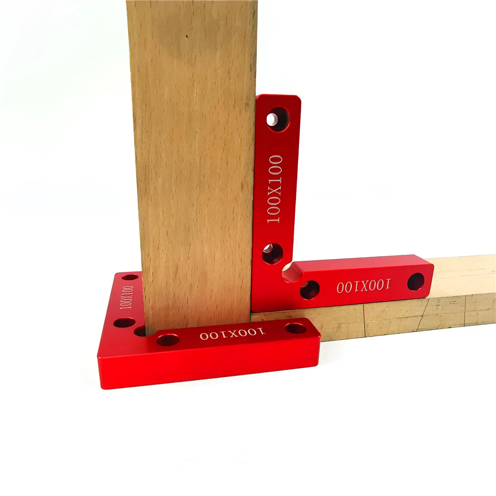 Aluminum alloy woodworking right angle positioning block on a workbench.
