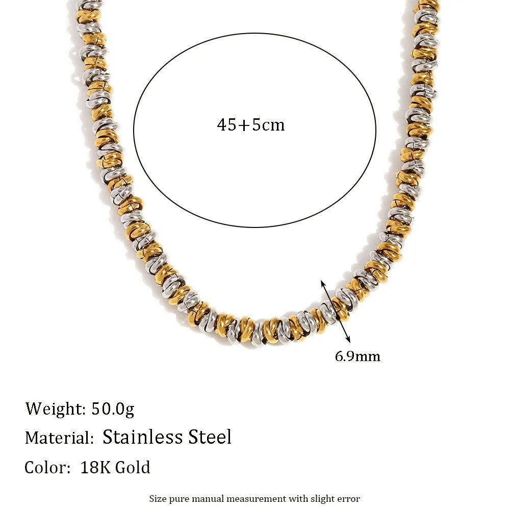 Gold electroplated geometric jewellery set with earrings, bracelet, and necklace on stainless steel