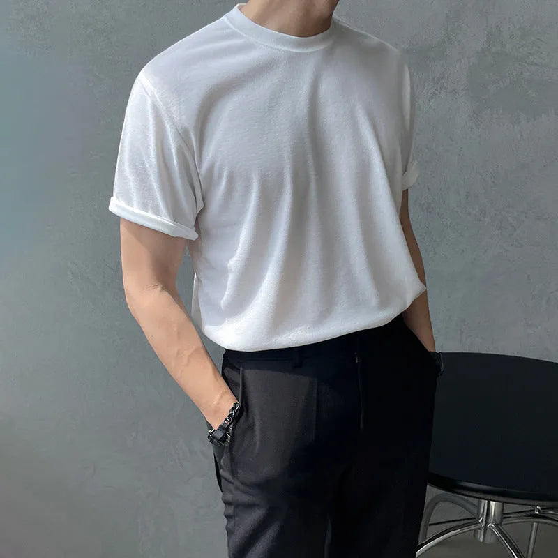 A man's slim-fit cotton T-shirt in solid white, showing the regular half-length sleeves and round neck.