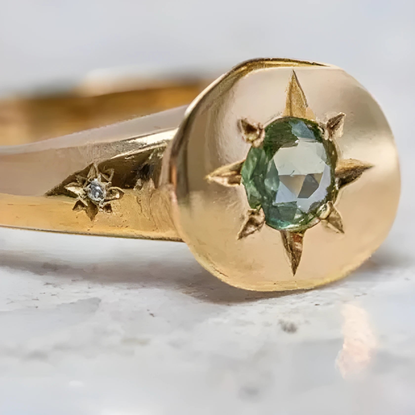 Gold star ring with oval zircon stone on an adjustable zinc alloy band.