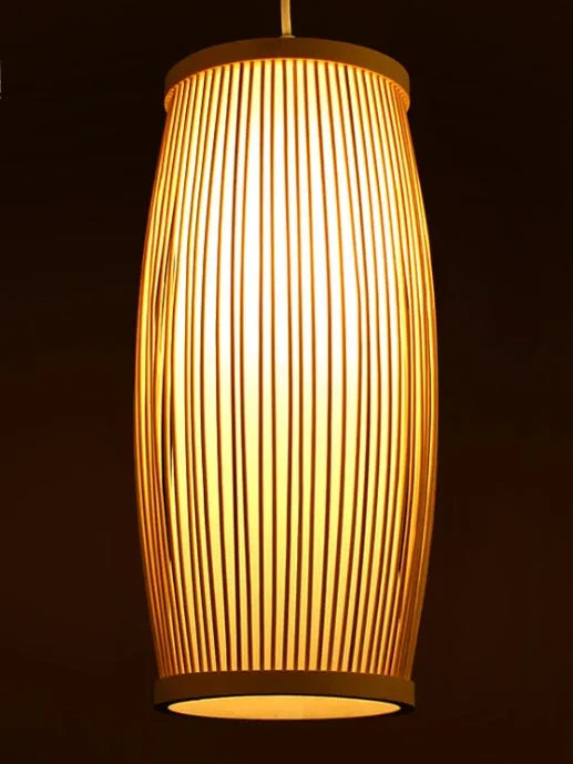 Close-up of a woven bamboo pendant light with a white E27 lamp holder, showing its natural texture and compact size.