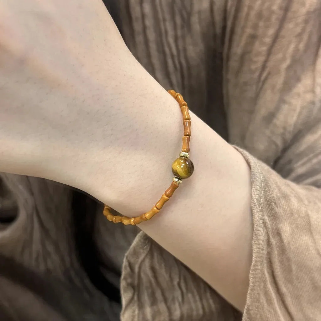 Natural yellow Tiger's Eye Hetian Jade bracelet in U-shape with gold gourd charm.