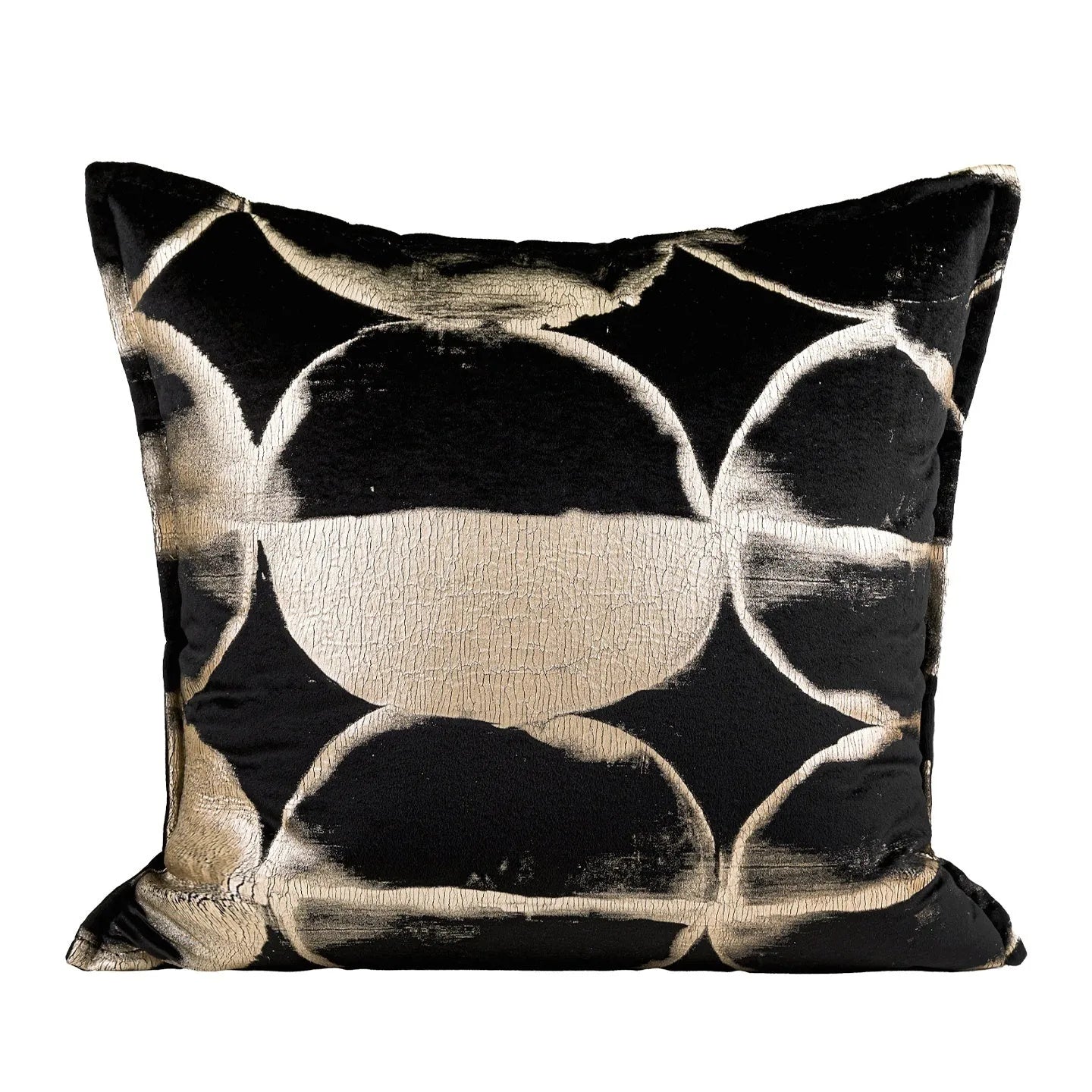 Black and gold abstract pattern flannel decorative cushion on a grey sofa.