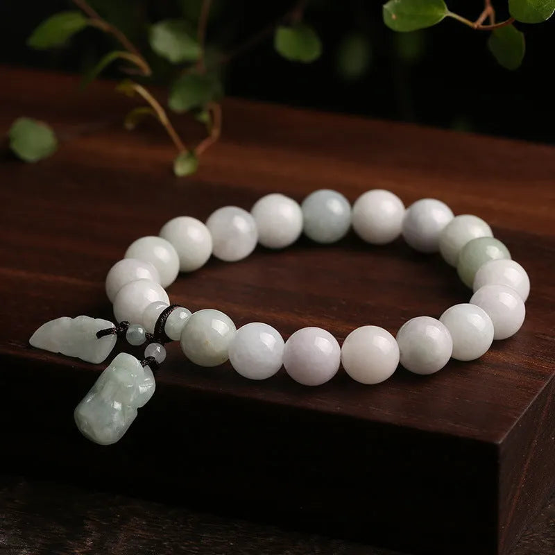 Natural jade geometric bracelet with hanging charm showing Apple design option