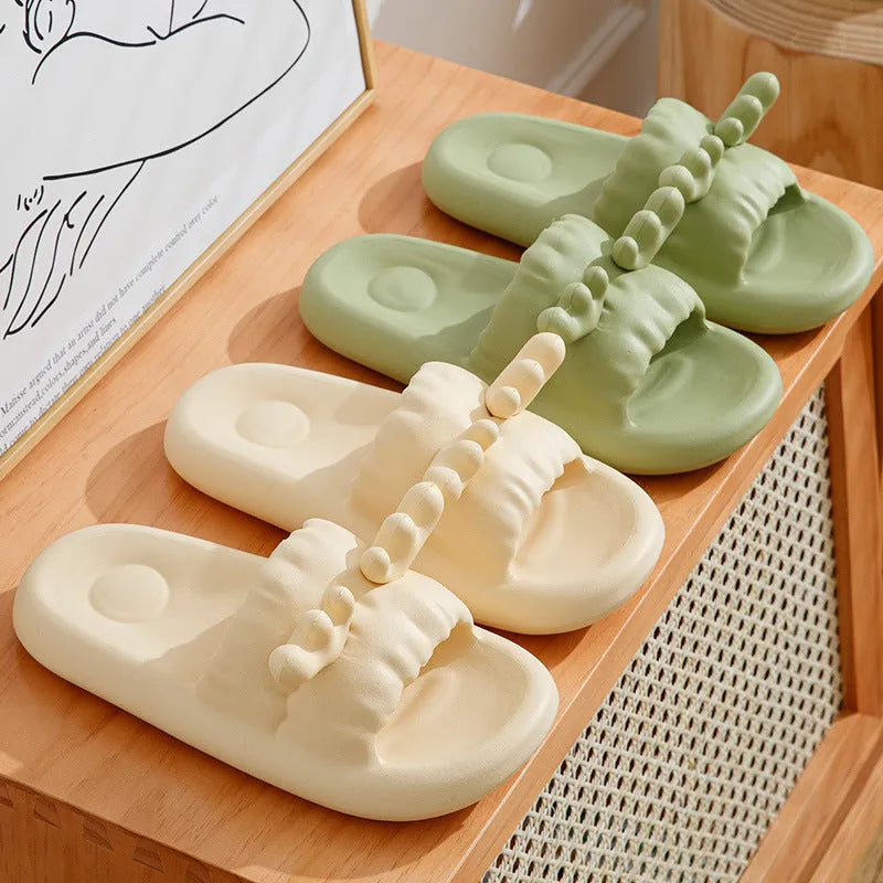 Women's deer horn design flip flop slippers in light yellow EVA material with hollow-out pattern.