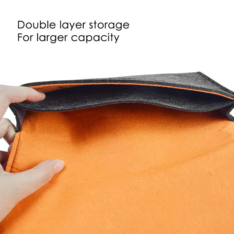Black Nintendo Switch felt pouch showing game card slots and double storage compartments