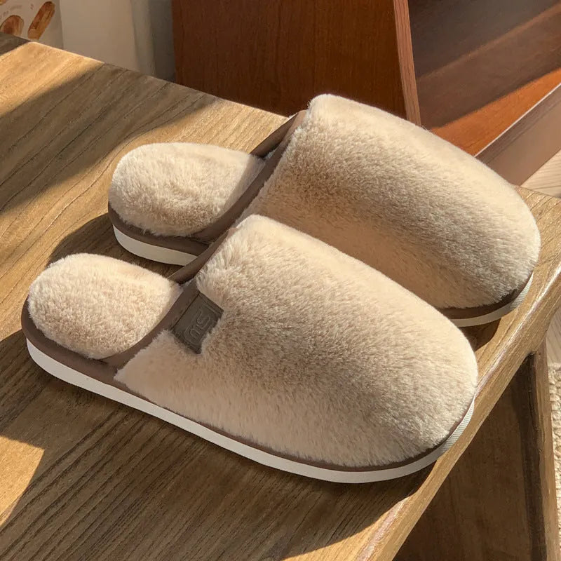 PVC non-slip winter slipper in a solid colour on a wooden floor.