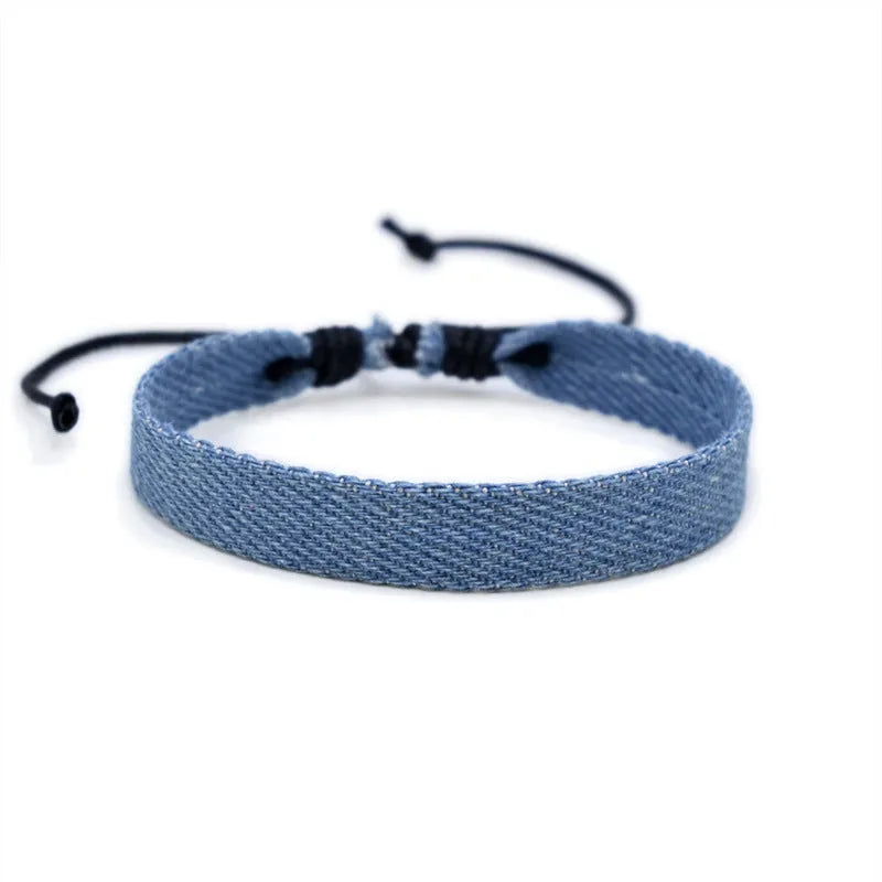 Denim fabric bracelet carrying strap in unisex design with mixed materials and cute styling