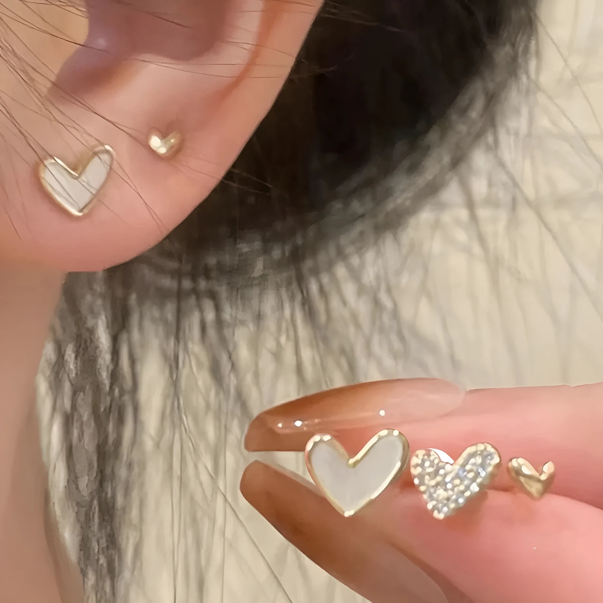 Three pairs of heart-shaped alloy earrings with love motifs in four colour options