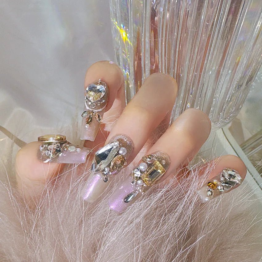 Rhinestone-decorated false nail patches on card packaging with application adhesive and tools