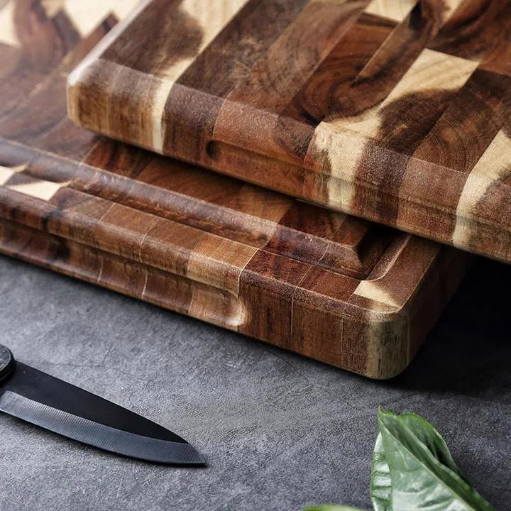 Brown imported acacia solid wood cutting board with 3cm thickness on kitchen counter