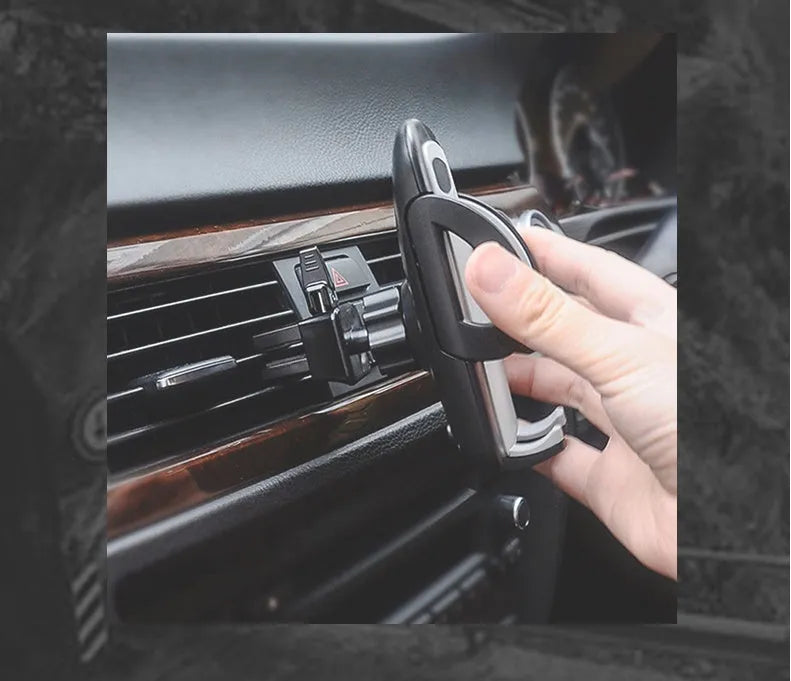 Black plastic car vent mobile phone holder with adjustable arms for universal device compatibility