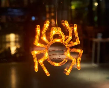 Set of seven Halloween-themed LED hanging lights with suction cups for window display