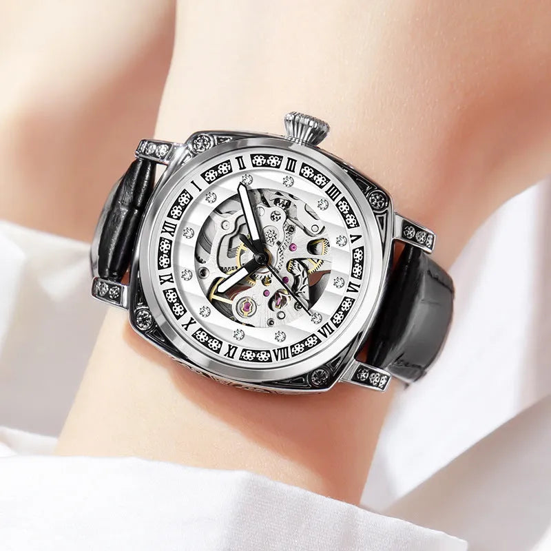 Mechanical watch with luminous hands and leather strap in choice of colours.