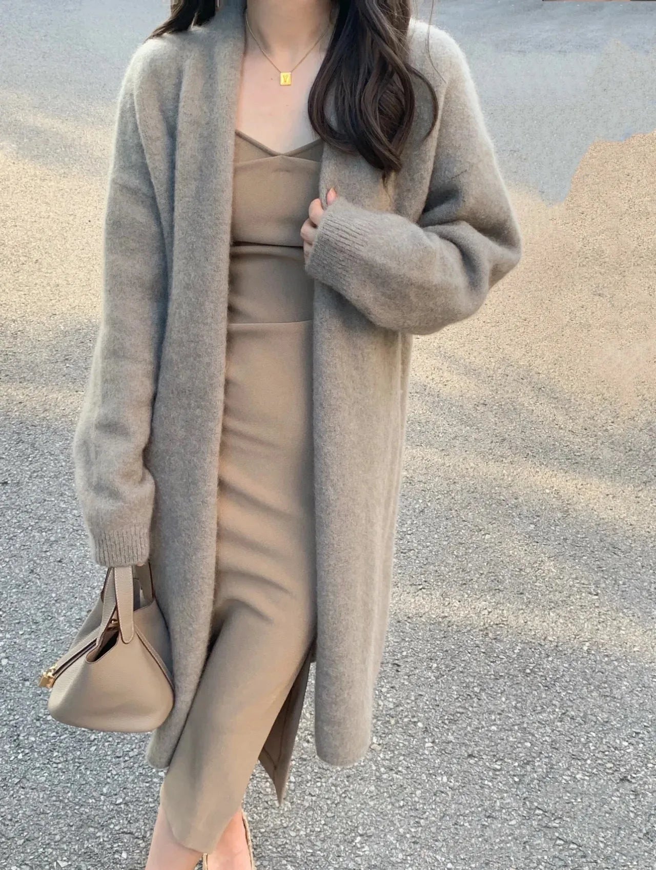 Women's loose fit knitted cardigan in khaki with V-neck and long sleeves.