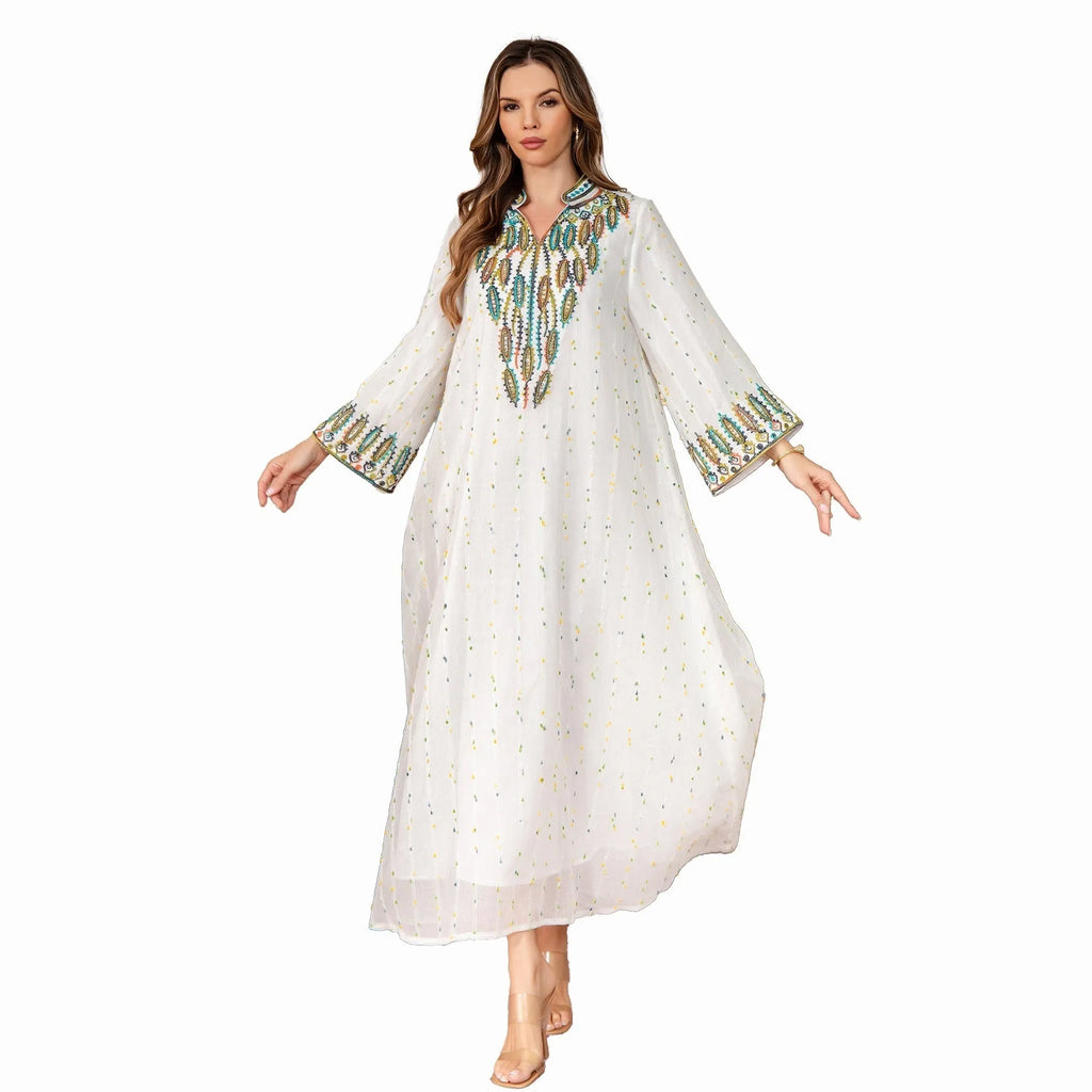 White long sleeve, long skirt Arabic robe for women on a hanger.