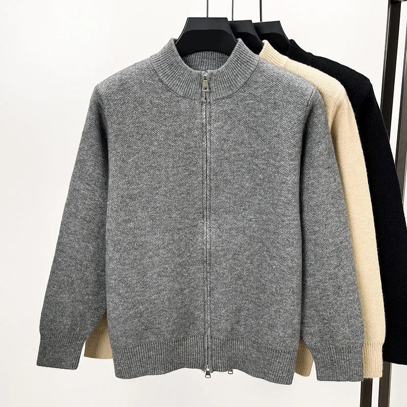 Men's loose grey knitted cardigan with a stand collar and a front zipper.