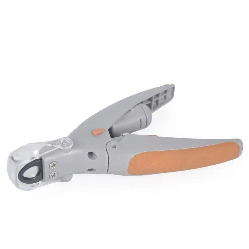 Dog nail clipper with illuminated LED light and visible blood line guide on the cutting head.