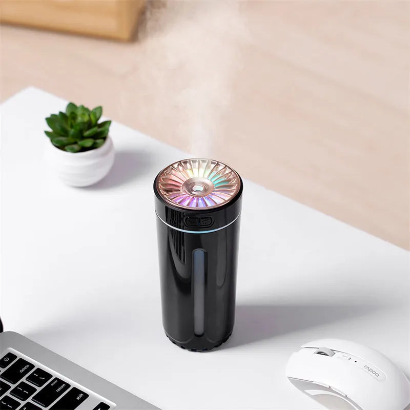 Black portable USB rechargeable humidifier with colourful LED lights and compact design for car or desktop use