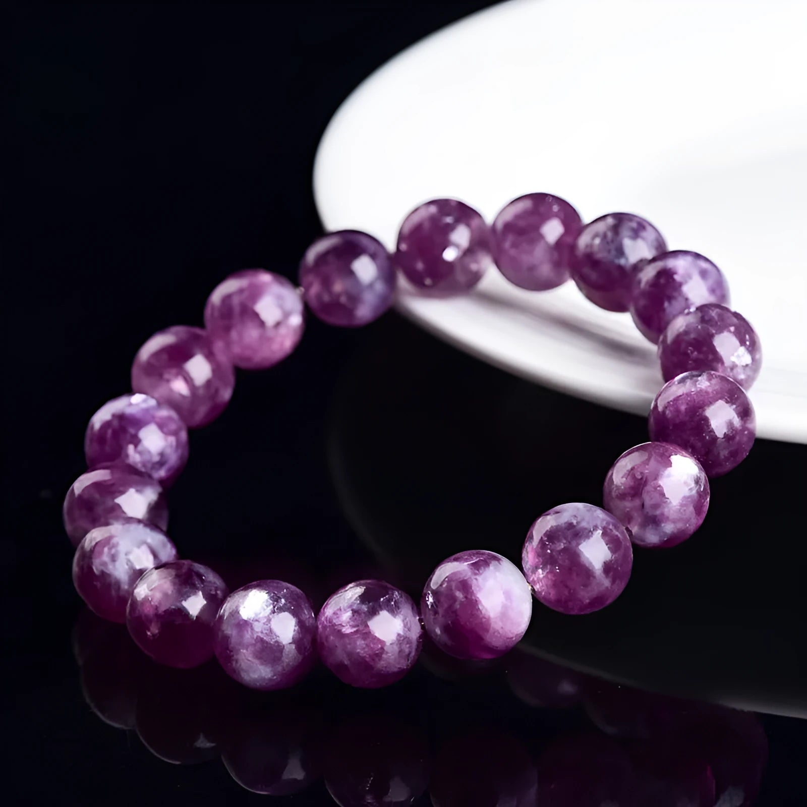 Purple grandmother crystal bracelet with polished geometric beads on wrist