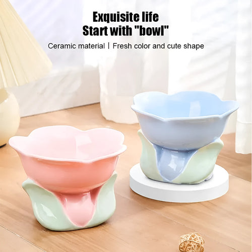 Blue ceramic elevated pet bowl with floral pattern and non-slip base for cats or small dogs.