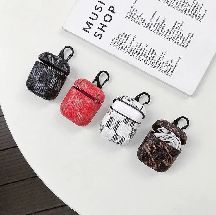 IPhone XS Max hard plastic case with grid pattern and anti-lost hook, next to a compatible AirPods 2 leather charging case.