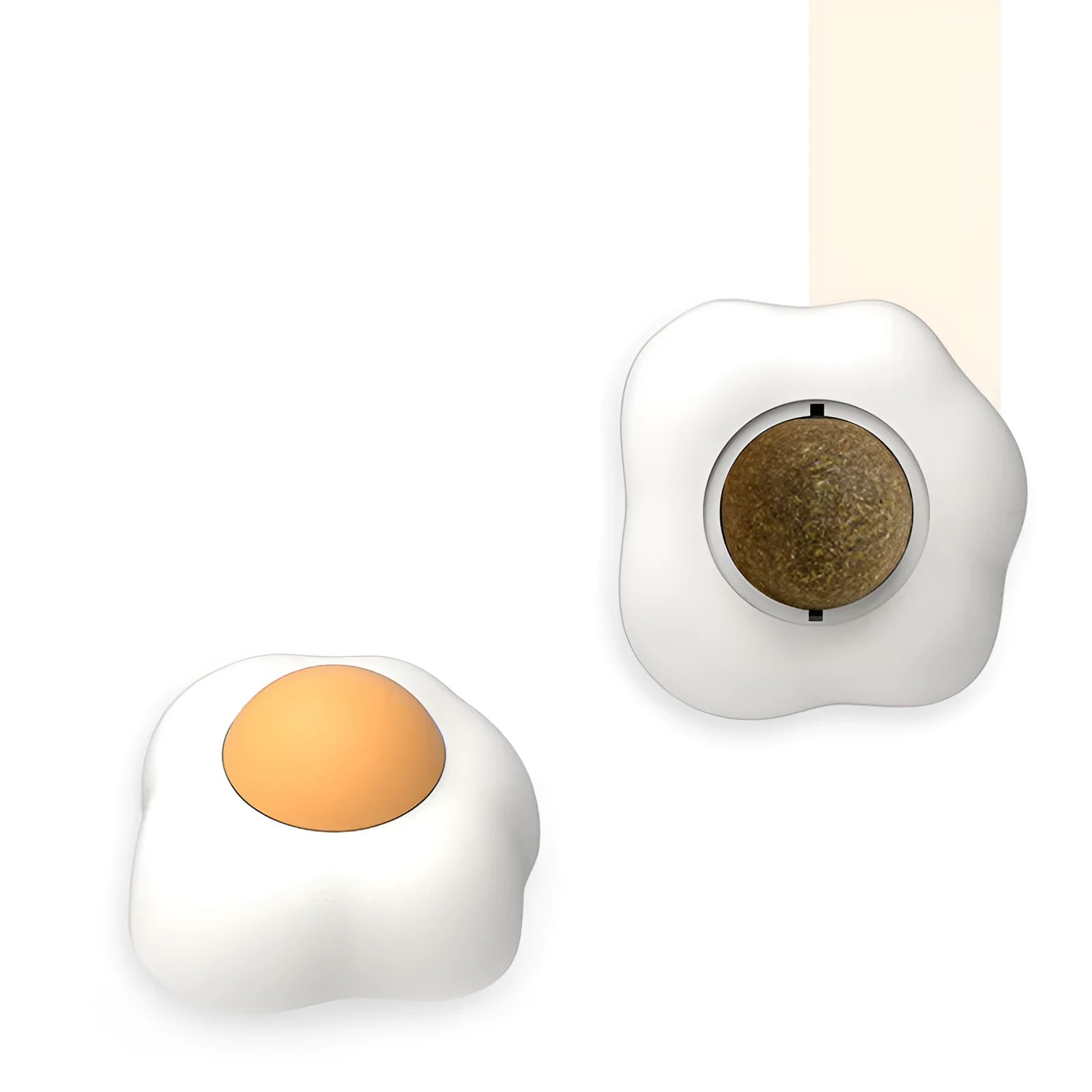 Soft plush catnip ball toy with suction cup mounted on a wall, shown in fried egg and poached egg shapes.