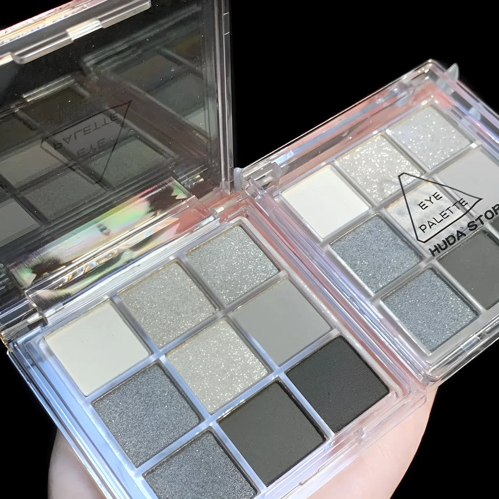 Smoked case nine colour eye shadow palette showing white, silver, black, and iron grey shades