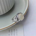 Adjustable copper vintage ring with white chalcedony style colour and U-shaped open mouth design