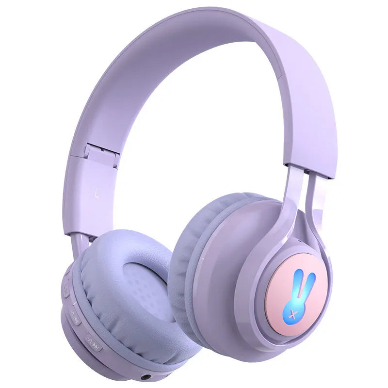 Wireless RGB LED headphones for children in bunny pink with lights illuminated