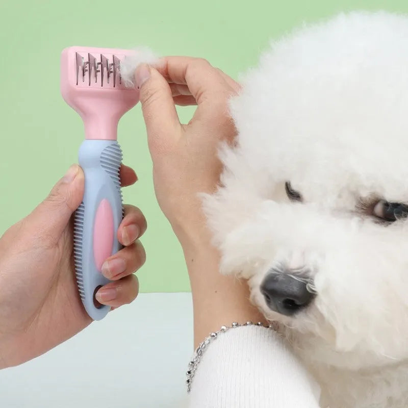Stainless steel pet grooming comb with integrated knot knife, shown in pink and purple colour options.