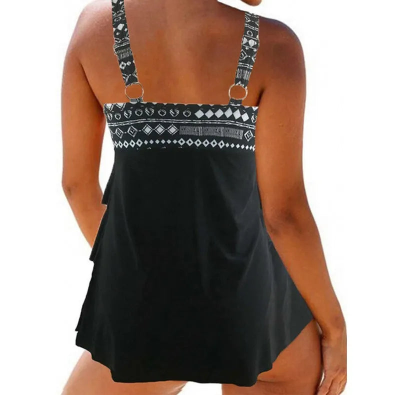 Women's plus size split swimsuit with double shoulder straps and bow detail in polyester fabric.