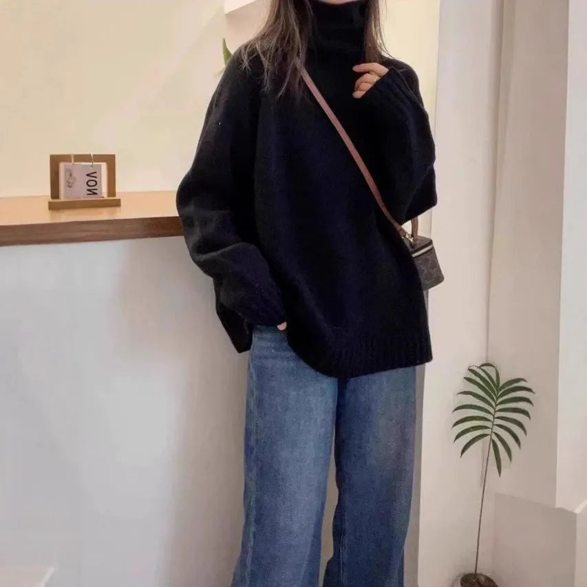 Women's loose-fit turtleneck sweater with thick curling pile collar in black, camel, grey, or red.