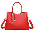 Women's black PU messenger bag with multi-layer design and visible sewing thread detail.