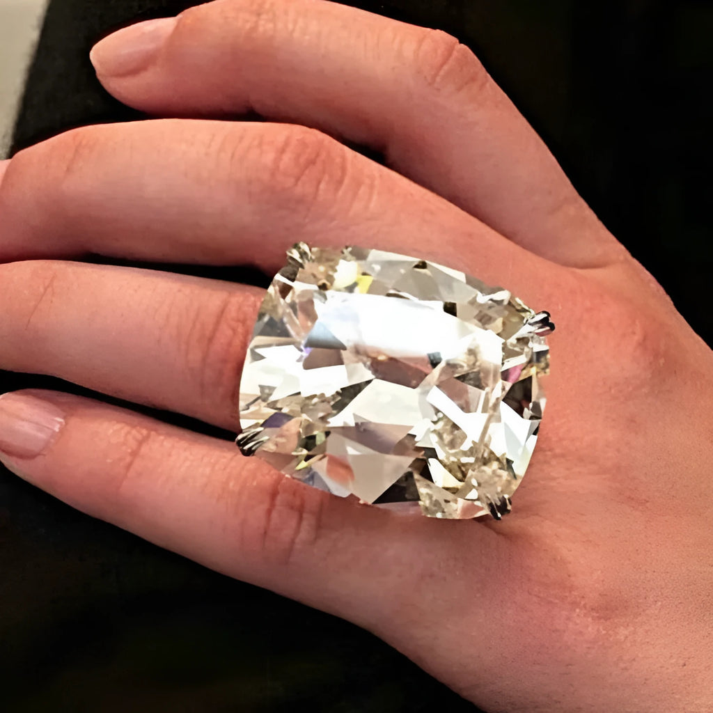 Women's simple geometric alloy ring with a square diamond inlay in white gold colour, shown on a finger.