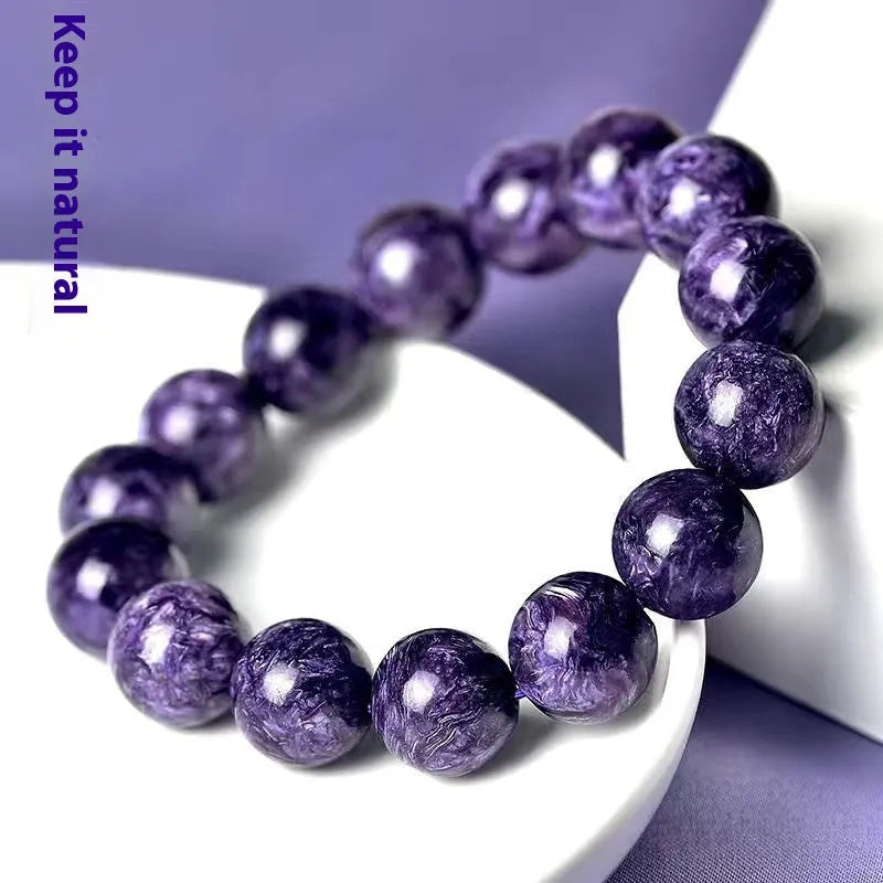 Natural purple charoite crystal bracelet with platinum tone metal chain, showing four bead size options.
