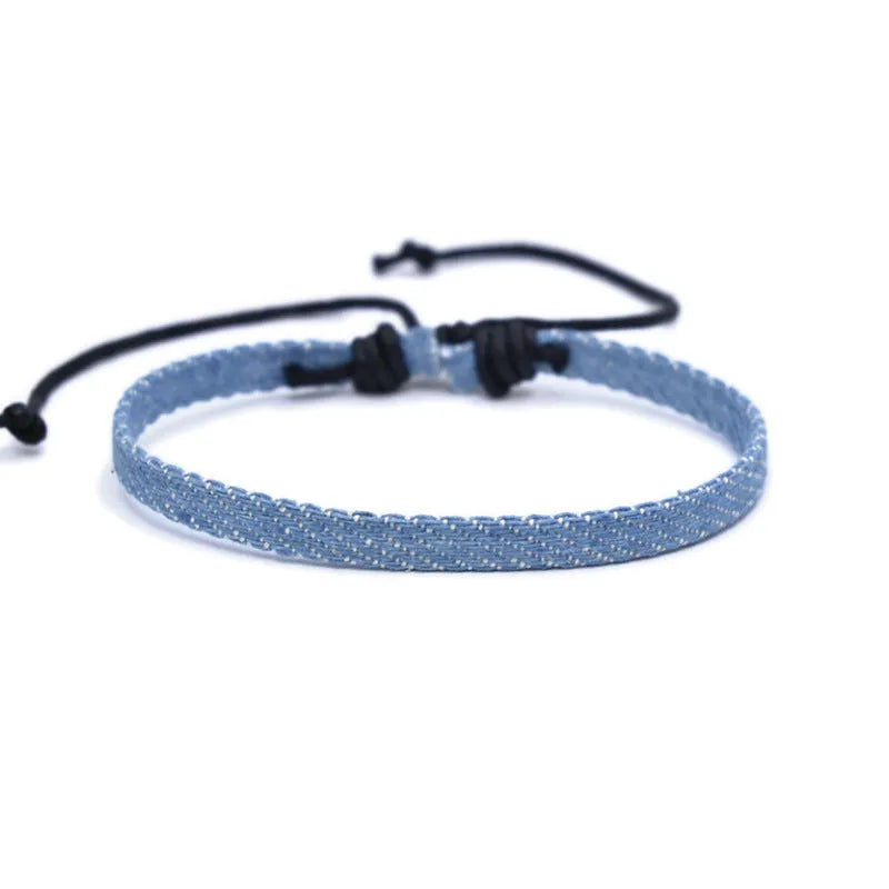 Denim fabric bracelet carrying strap in unisex design with mixed materials and cute styling