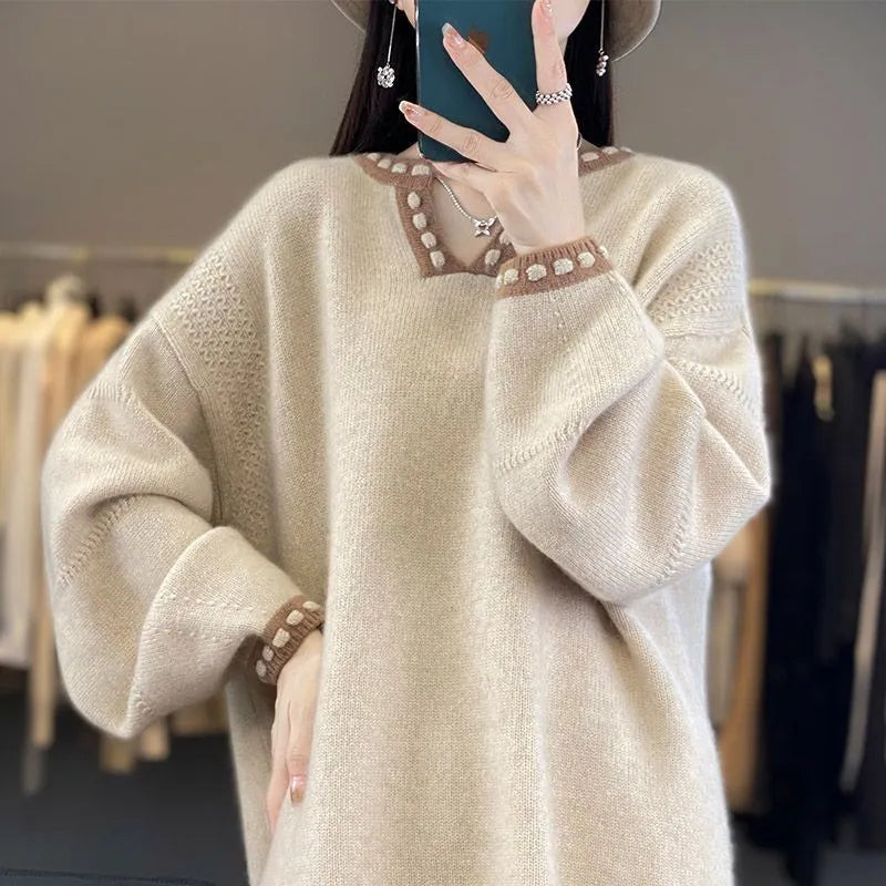 Women's camel and white V-neck viscose pullover sweater with long sleeves.