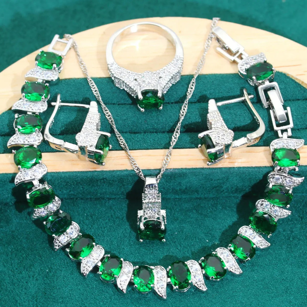 Bridal zircon four-piece jewellery set with necklace, earrings, bracelet, and ring in water wave chain style.