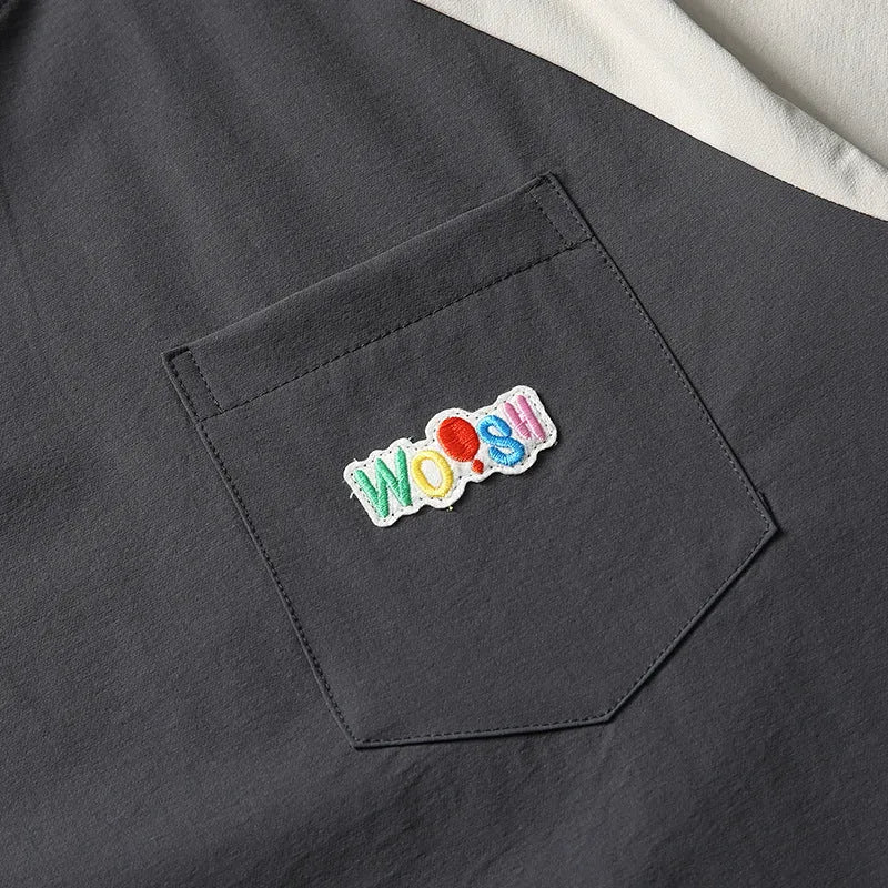 Dark grey men's loose fit t-shirt with contrast colour raglan short sleeves.