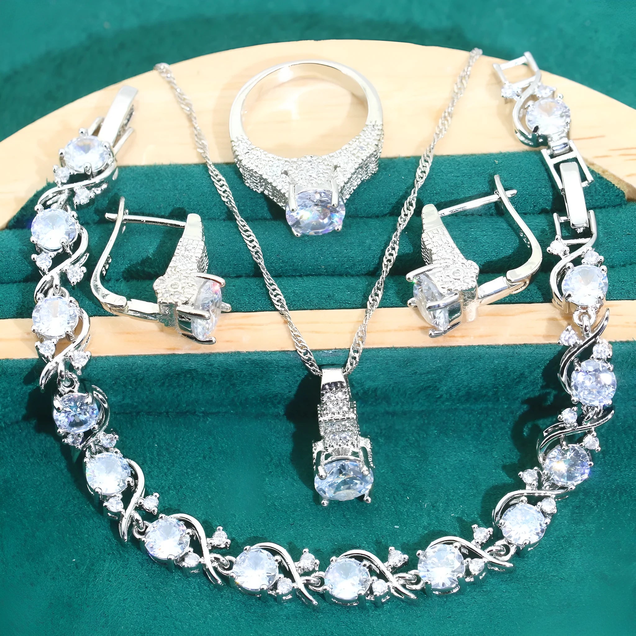Bridal zircon four-piece jewellery set with necklace, earrings, bracelet, and ring in water wave chain style.