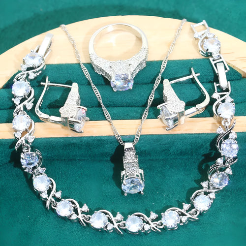 Bridal zircon four-piece jewellery set with necklace, earrings, bracelet, and ring in water wave chain style.