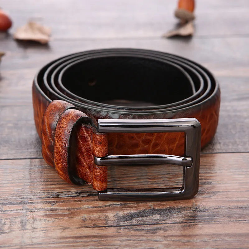 Men's business belt showing laser pattern detail with alloy pin buckle on imitation leather strap