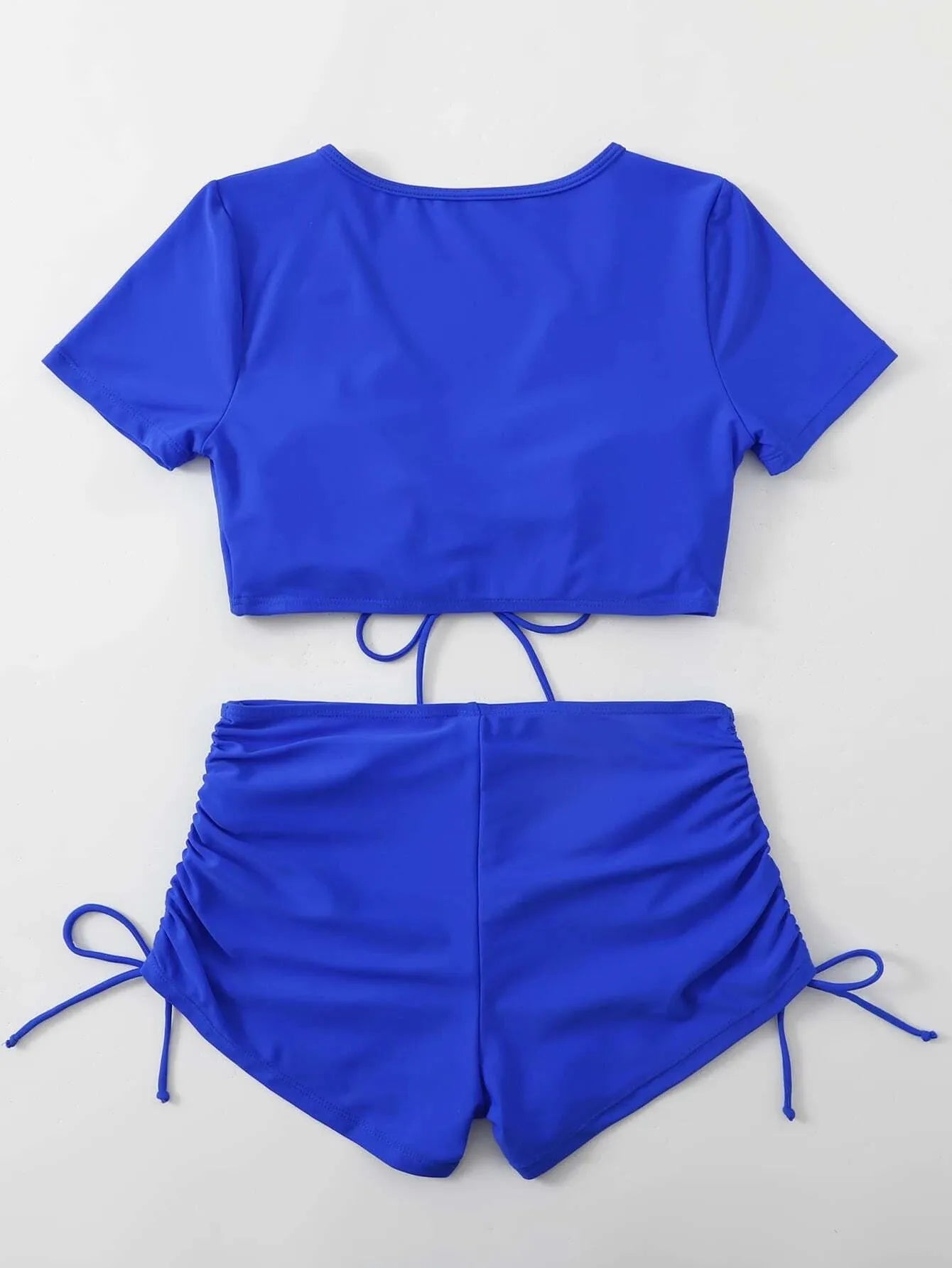 Women's lace-up swimsuit top with matching shorts in dark green colour