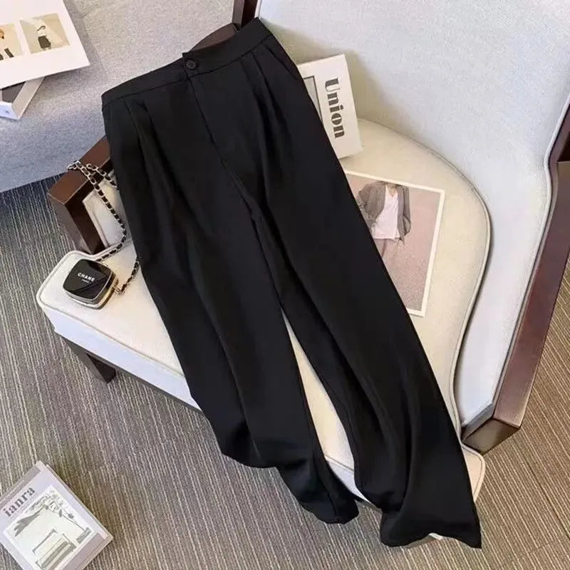 Women's loose fit polyester blouse in black showing slimming silhouette and regular sleeves