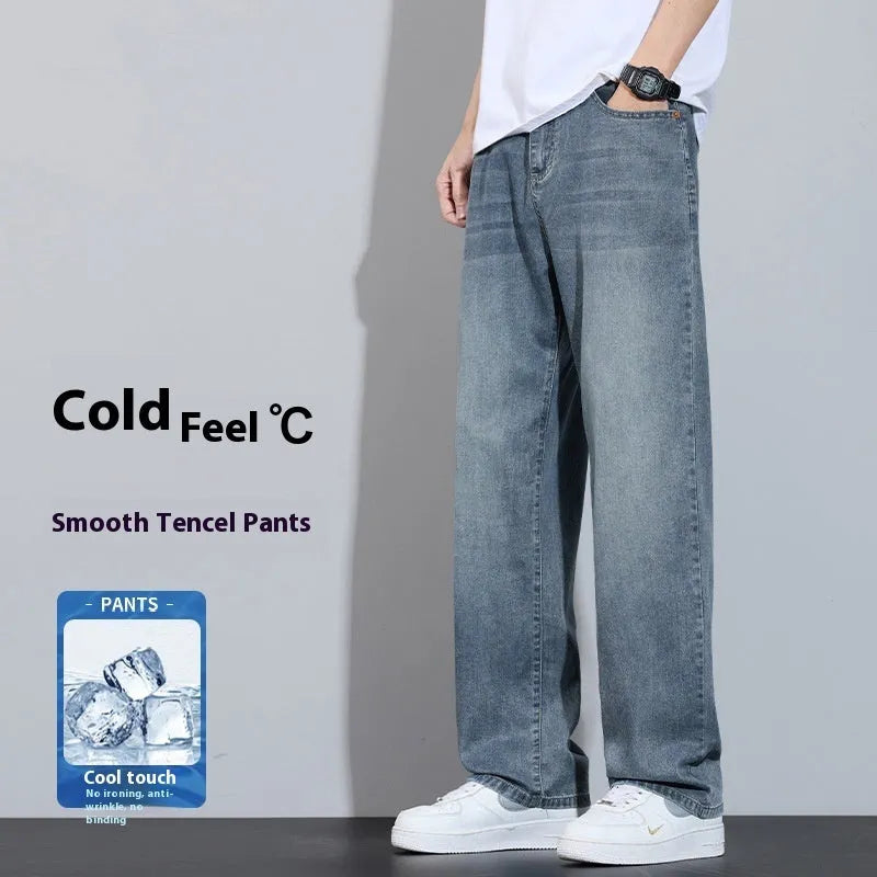 Light blue ice silk straight-leg wide trousers laid flat, showing zip fly and relaxed leg cut.