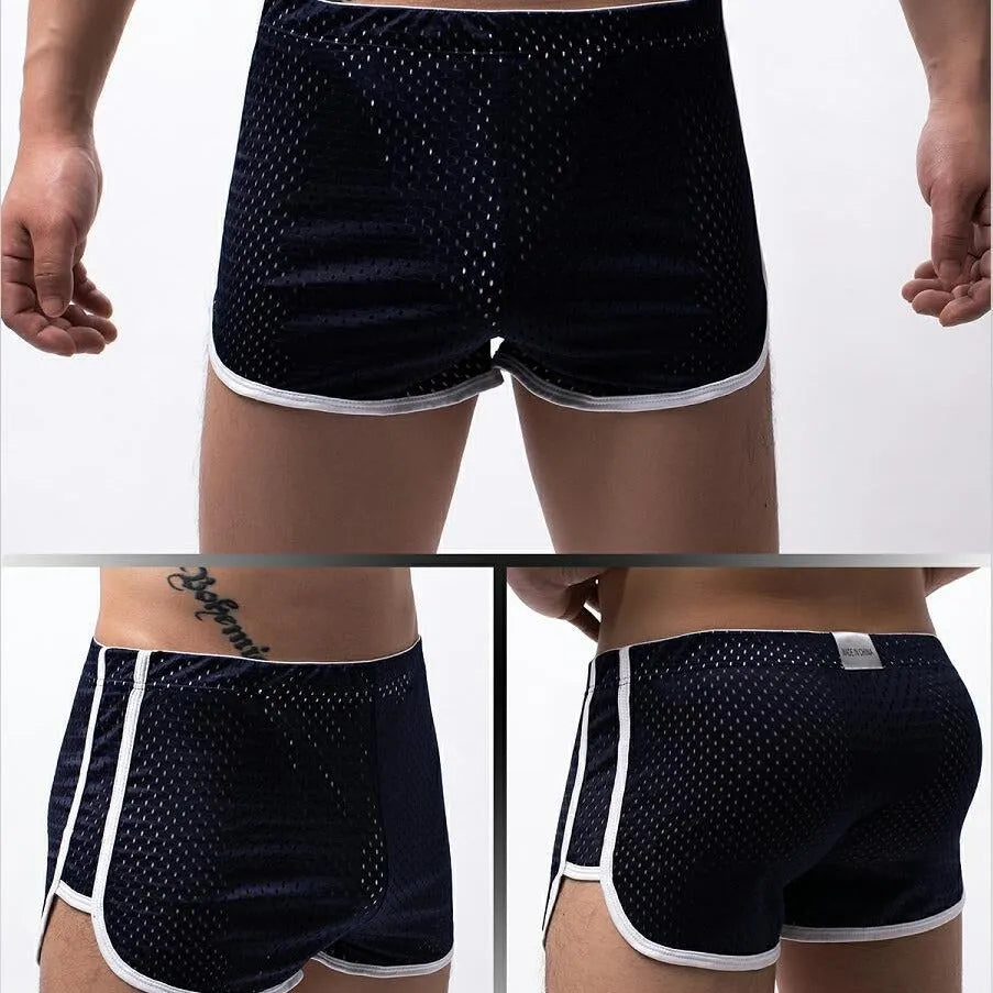 Men's black boxer shorts showing three-point ventilation panels and a mid-waist design.