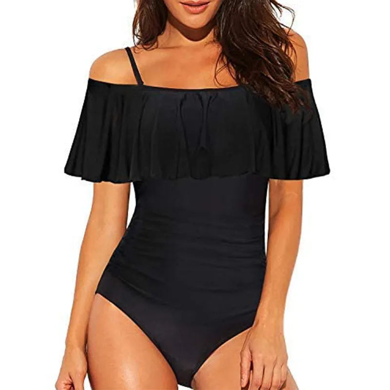 Black one-piece swimsuit with cut-out design and ruffled strap tube top
