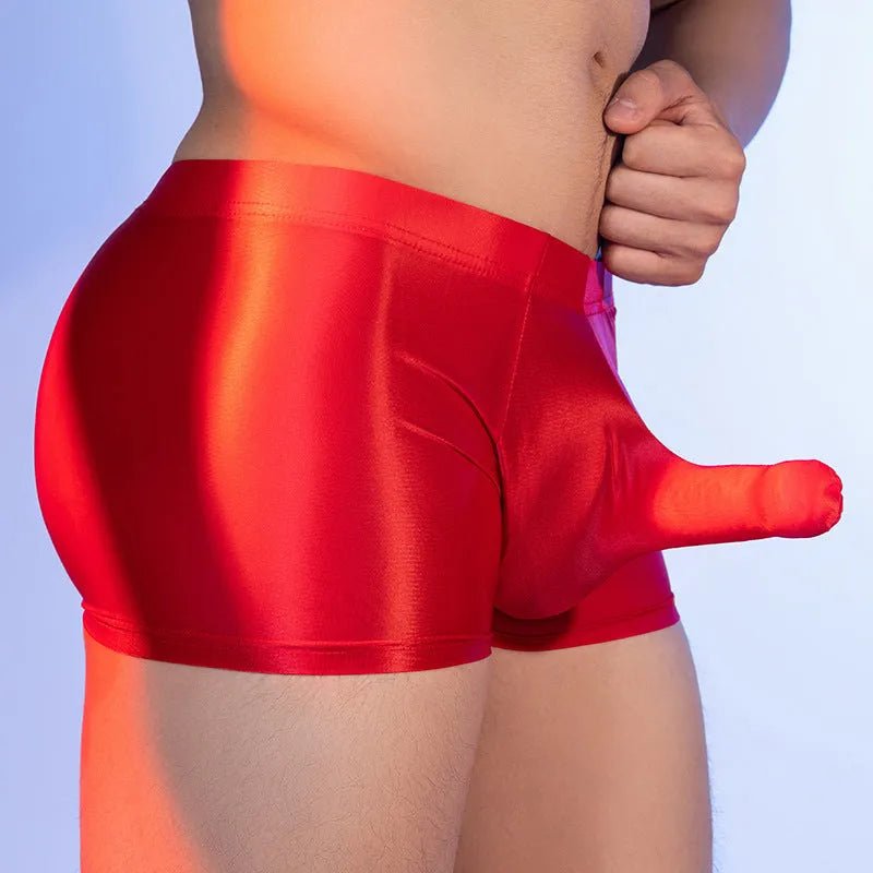 Men's red boxer shorts with a seamless nylon build and a printed elephant nose design on the front.